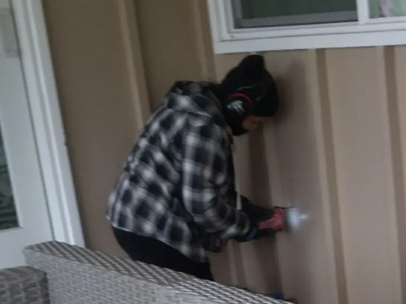 Professional electrician installing an exterior outlet in Washington